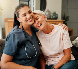 Nurse woman and senior woman are smiling