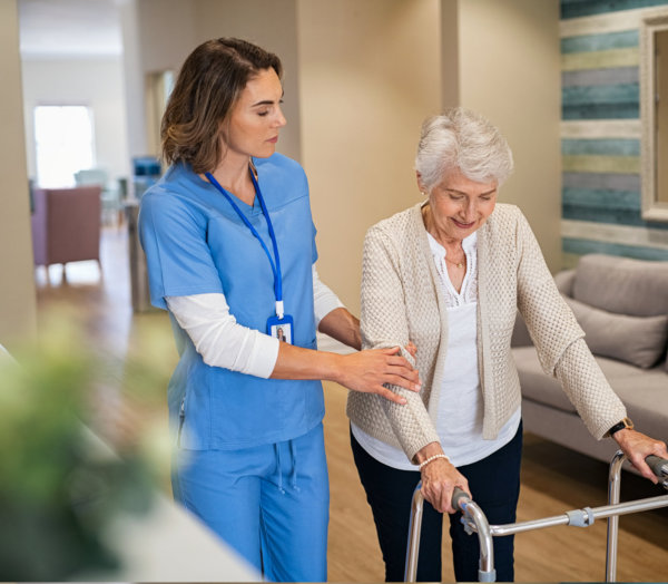 Nurse is guiding the senior woman to talk