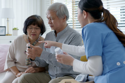 Nurse are showing the medicine to seniors