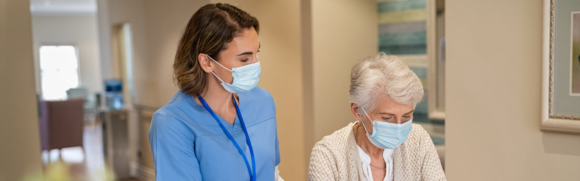 Nurse woman is guiding senior woman to walk