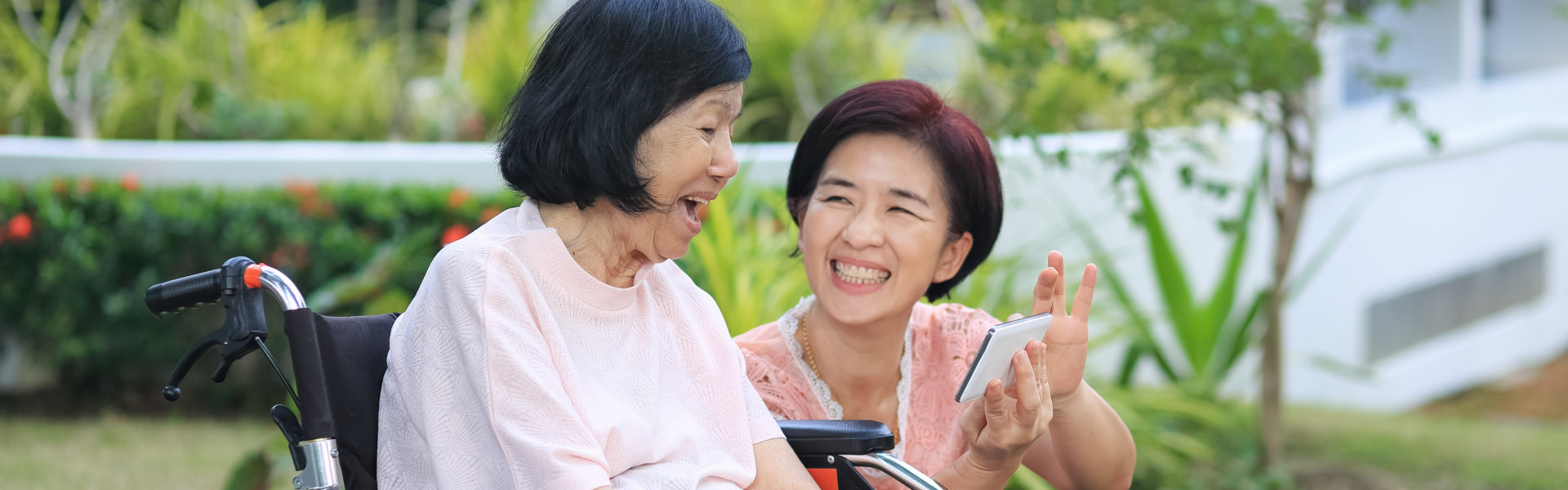 Daughter caring for the elderly women ,do selfie, happy, smiles in backyard.