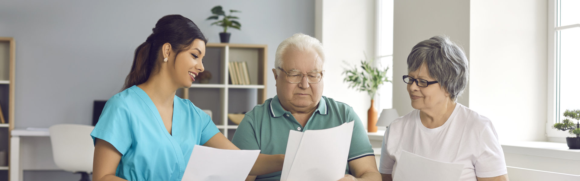 home care nurse helps senior patients fill informed exam consent