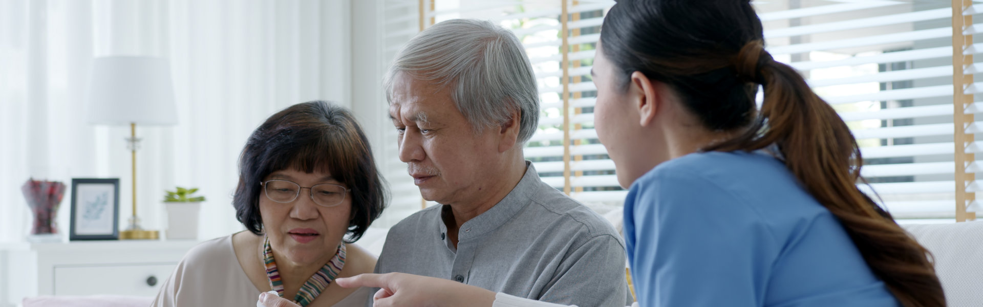 Nurse are showing the medicine to seniors